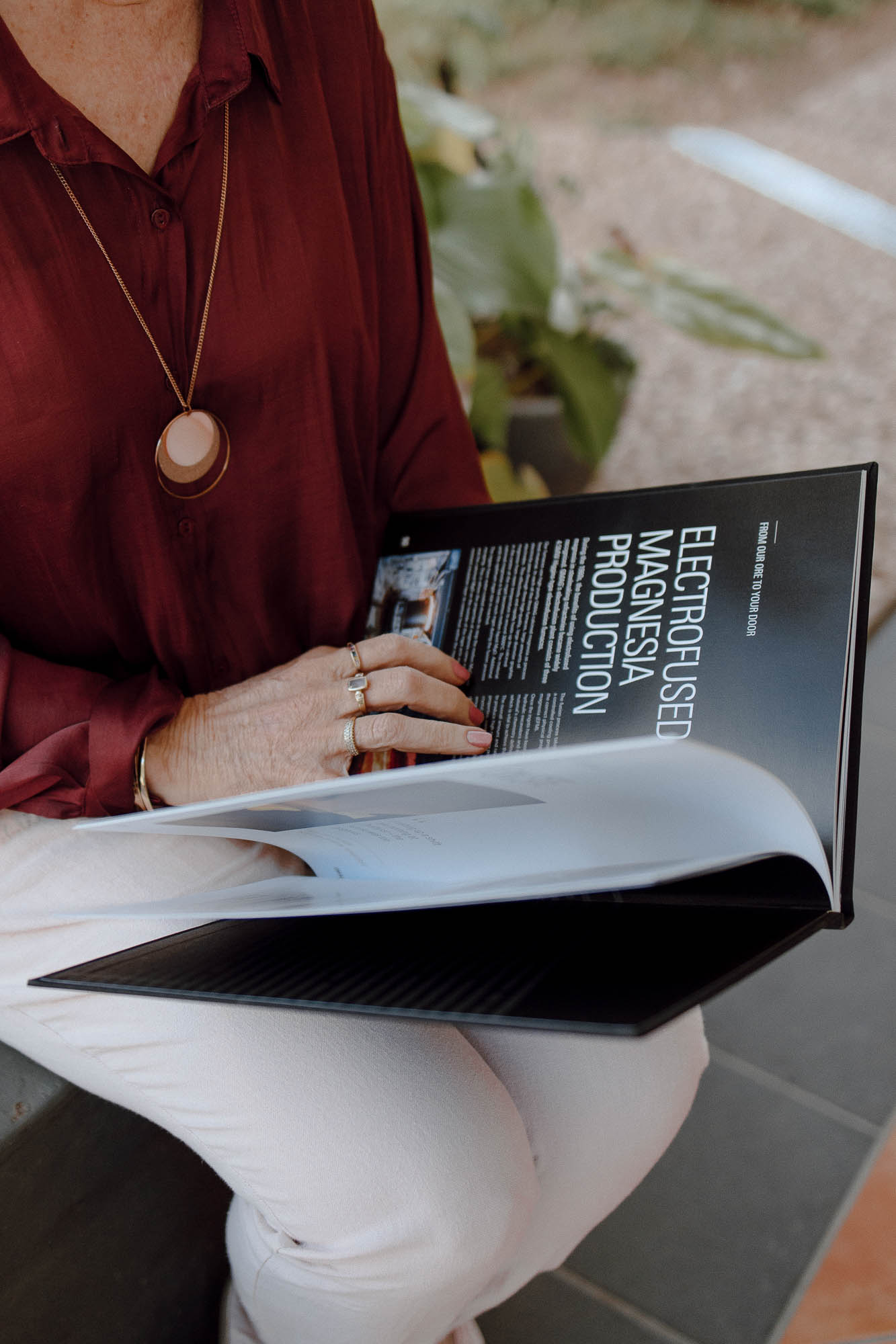 Rockhampton copywriter, Deb flipping through the pages of a magazine