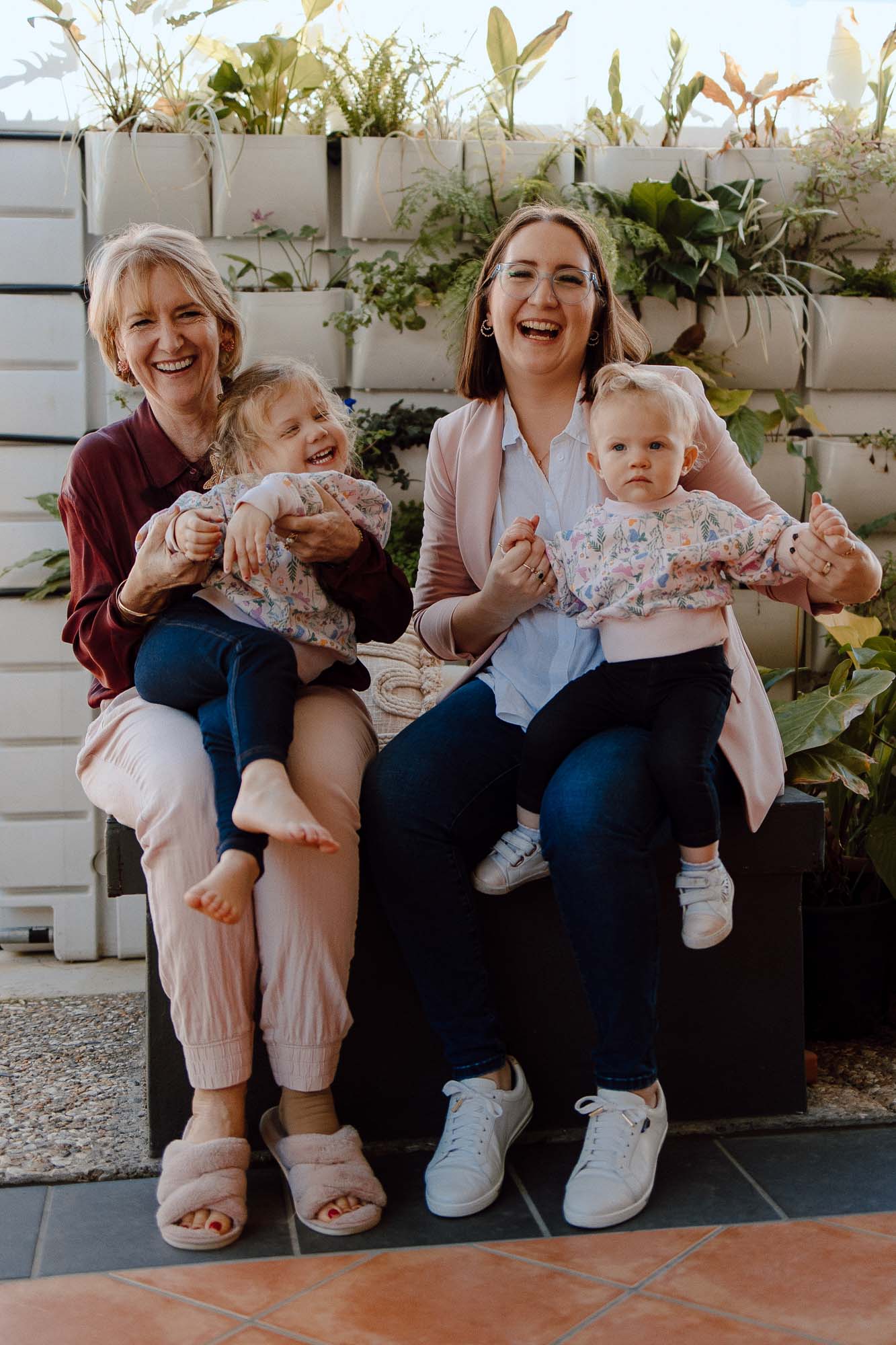 Meet Rockhampton Copywriters SJ and Deb, sitting with their daughters/grand daughters.